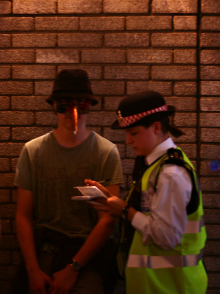 Epic Nose Guy being served with a piece of paper that says he might get a [[party van|court summons