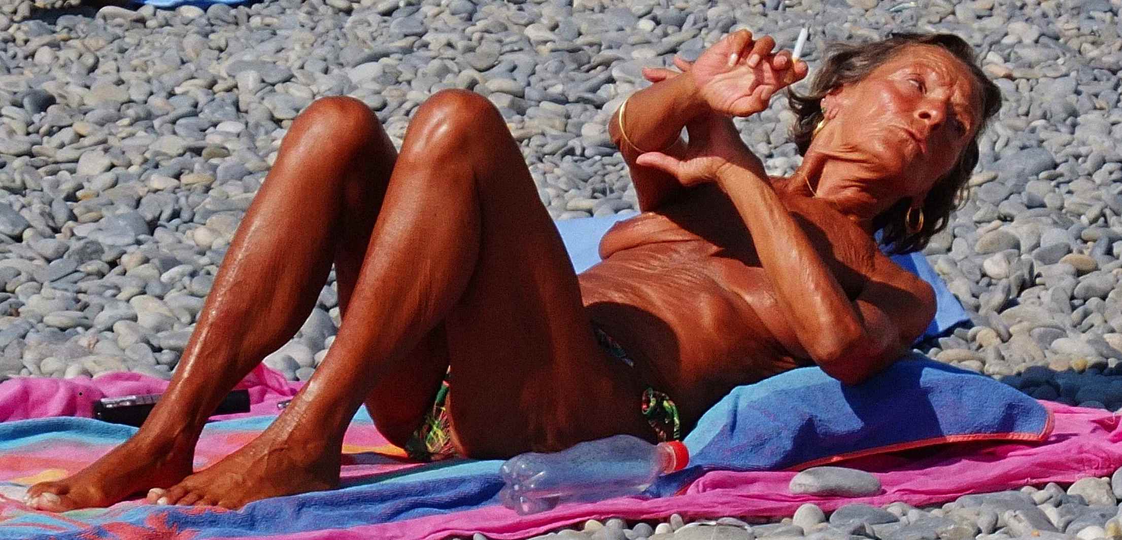 Typical hot French chick engaging in national pastime of suntanning to the death