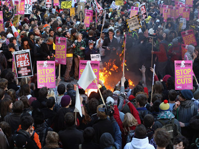 "Anarchist students" who are actually SWP members starting a fire and trashing London, [[Britfagland