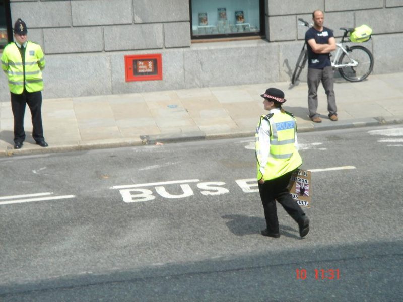 The sign gets taken away, because in a police state you cannot protest.