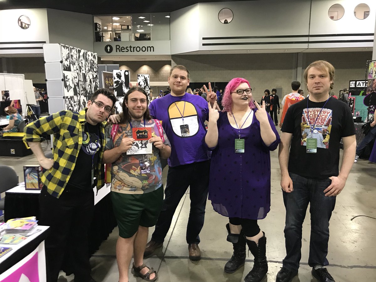 A group photo of all of the currents of the podcast and a fan. A picture speaks a thousand words.